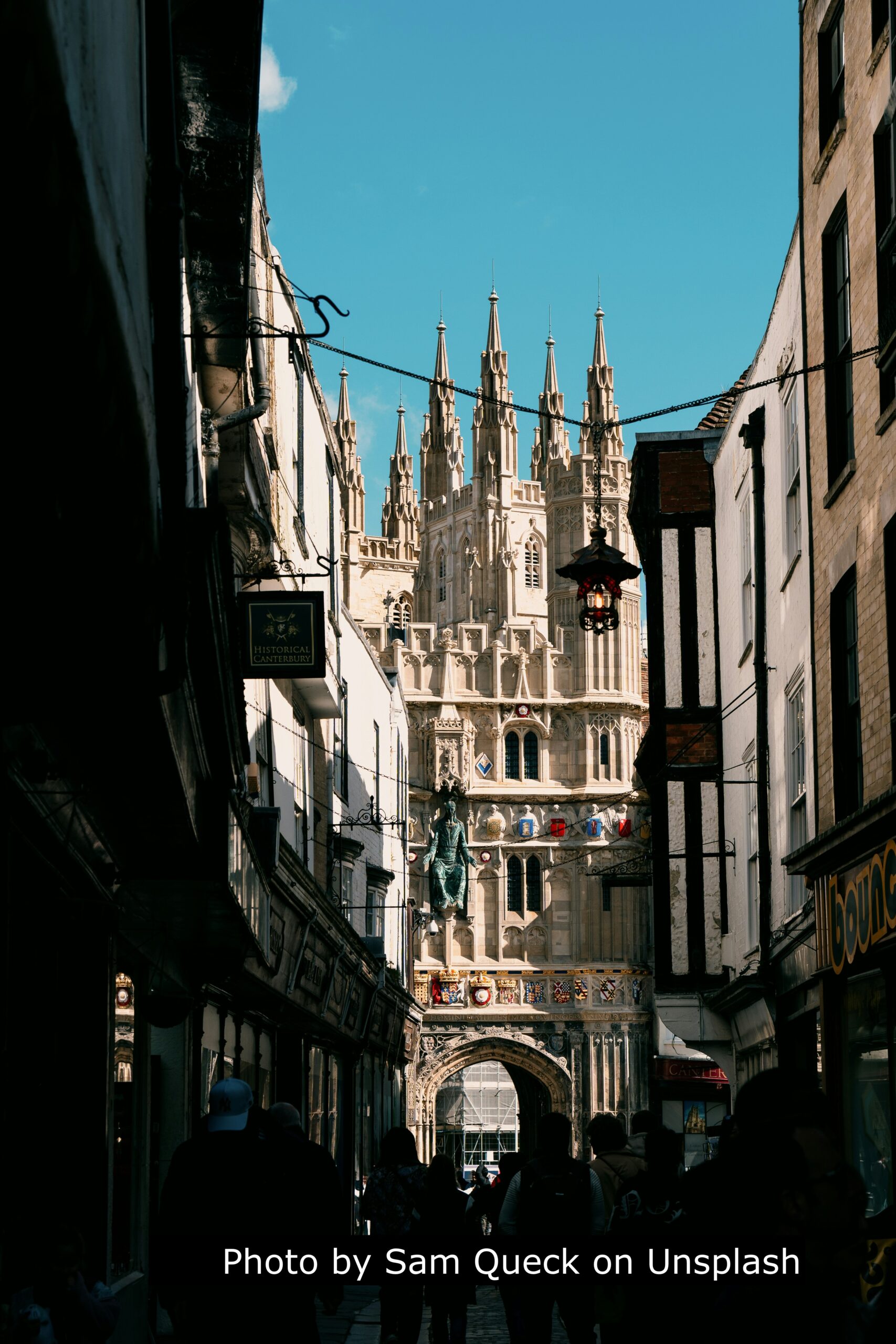 Canterbury cathedral gate seen down narrow lane